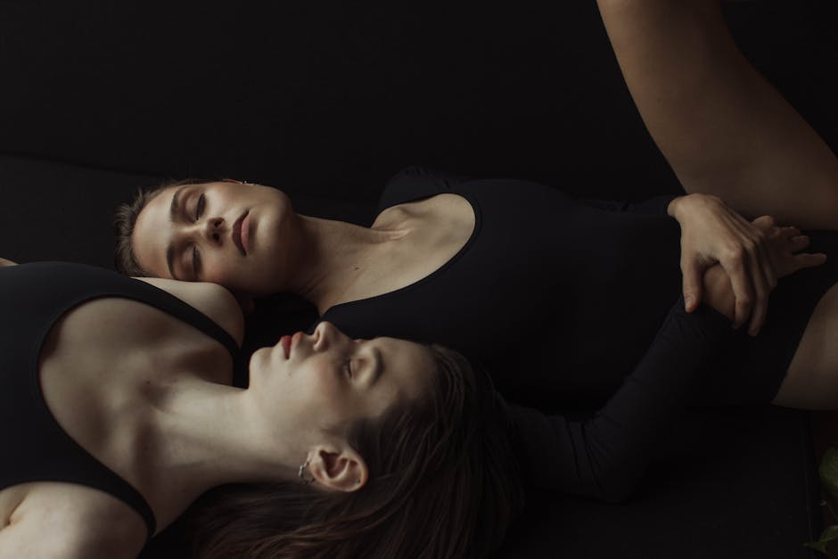 Woman performing a serene yoga pose in a beautifully lit, minimalist room.